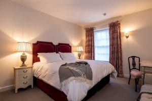 allington court bedroom with red bed