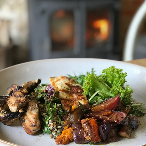 A plate full of fresh seasonable fruit, vegetables and meats